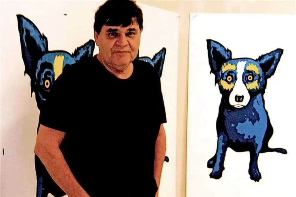 George Rodrigue Next to Blue Dog Painting
