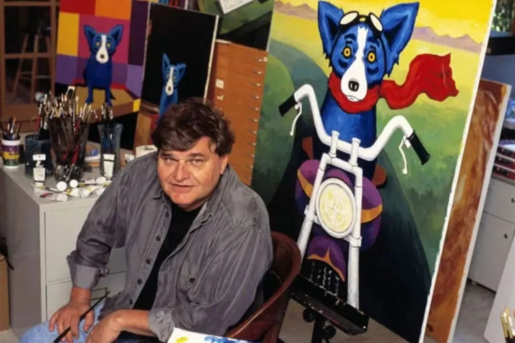 George Rodrigue next to Blue Dog Painting